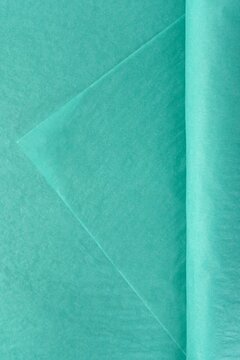 Soft turquoise tissue wrapping material for flowers stacked in sheets isolated on white background used for bouquet presentation decor and packaging