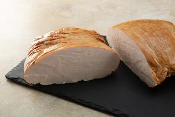 A view of a portion of turkey breast deli meat.