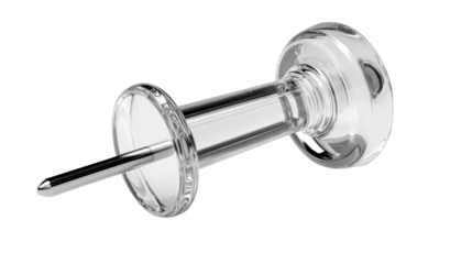 Clear glass paperweight with metal pin on a plain background used for holding documents and papers together