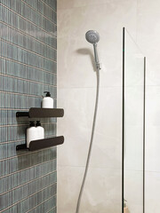 A modern shower system in a bathroom. Close-up, vertical photo.