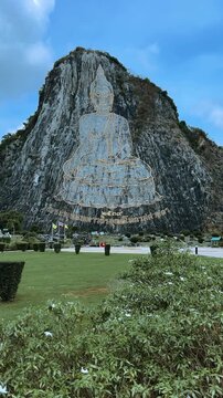 CHONBURI, Thailand - June 9, 2025: The Golden Buddha Mountain. The Buddha image carved into the rock of Khao Chi Chan, Khao Chion, Pattaya, engraved in gold,on a hill dedicated to His Majesty the King