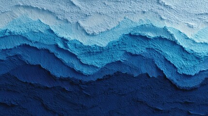 Creative layering in blue paint showcasing ocean waves in various shades and textures on a surface