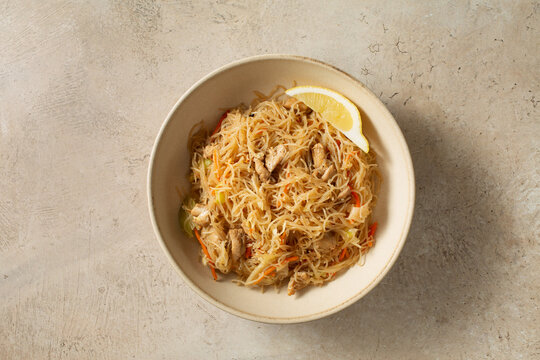 A top down view of a bowl of pancit bihon.