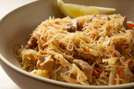 A closeup view of a bowl of pancit bihon.