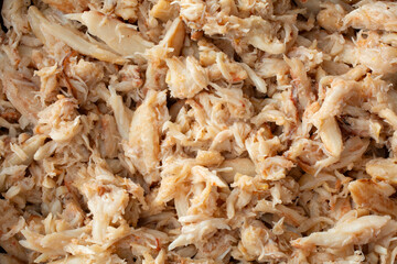 A top down view of a pile of wild crab meat, as a background.
