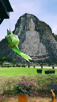 CHONBURI, Thailand - June 9, 2025: The Golden Buddha Mountain. The Buddha image carved into the rock of Khao Chi Chan, Khao Chion, Pattaya, engraved in gold,on a hill dedicated to His Majesty the King