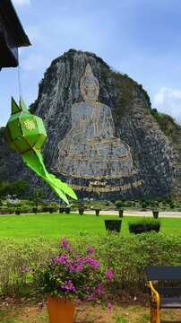 CHONBURI, Thailand - June 9, 2025: The Golden Buddha Mountain. The Buddha image carved into the rock of Khao Chi Chan, Khao Chion, Pattaya, engraved in gold,on a hill dedicated to His Majesty the King