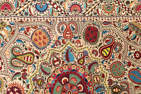 Traditional Uzbek and Persian-style carpets with vivid patterns and rich colors. Traditional oriental Uzbek handmade colorful carpets at the bazaar in Uzbekistan in Tashkent