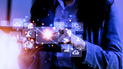 Businesswoman interacting with futuristic digital interface icons