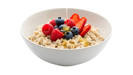 Sweet pearl barley porridge with assorted fresh berries and honey