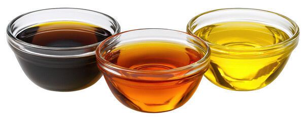 Three bowls of different colored liquids arranged in a row on a white background