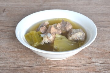 boiled pickled cabbage and bitter melon with pork bone in clear soup on bowl 