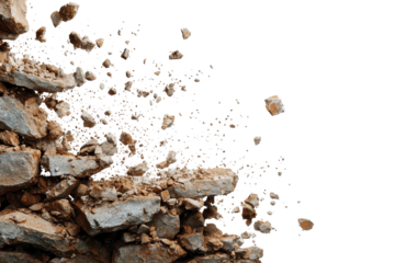 Debris falls from a crumbling stone wall during a demolition process in a construction site