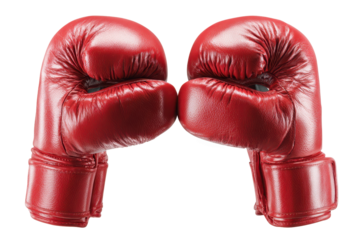 Two red boxing gloves touch each other in a display of readiness for a match or training session in a gym or sports setting