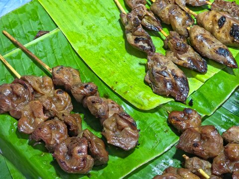 Grilled chicken offal (liver) skewers, a popular street food dish in many parts of the world, including Southeast Asia. 