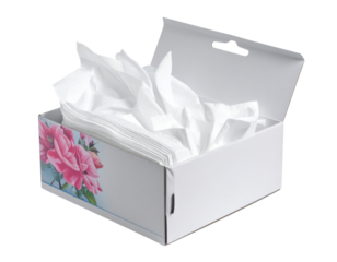 Open tissue box with floral design dispensing white facial tissues