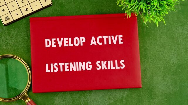 The words Develop Active Listening Skills materialize on a red plaque in a time lapse. Greenery, a magnifying glass and a calculator are nearby, set against a green background