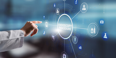 Hand pressing the ENDOSCOPY PROCEDURE button on a digital screen in a medical setting