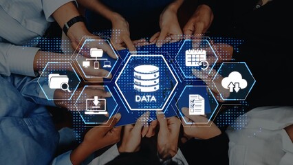 A group of diverse hands gather around a central icon representing data, symbolizing collaboration in technology and information management for modern businesses. Raster