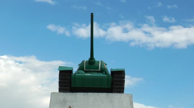  MONGOLIA, ULAANBAATAR - August 30, 2013: A tank T-34 -shaped monument at the foot of the Zaisan memorial, against the background of a blue sky with beautiful clouds on a sunny summer day.