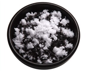 Black bowl with white topping on a white background