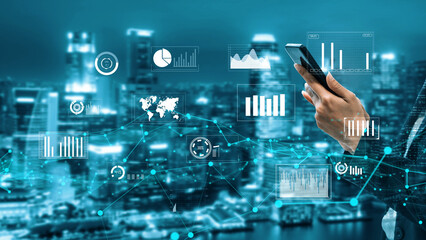 A business professional uses a smartphone to interact with digital graphs and analytics in a futuristic urban setting, demonstrating modern data-driven decision-making. Xenic