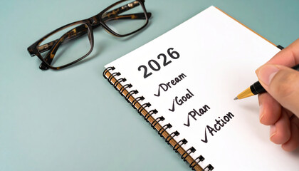 2026 budget goals finance new year list planning money budget savings investment success wealth motivation notepad with checklist and hand writing goals and action for personal finance planning
