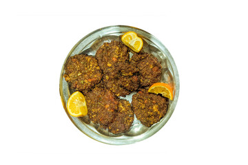 Chapli Kabab: A Peshawari Specialty of Pakistani Cuisine, these flavorful, spicy minced meat patties are grilled to perfection. Infused with a blend of aromatic spices and herbs.