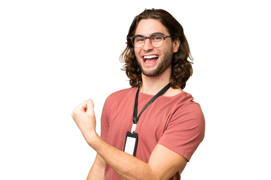 Young handsome man with ID card over isolated background celebrating a victory