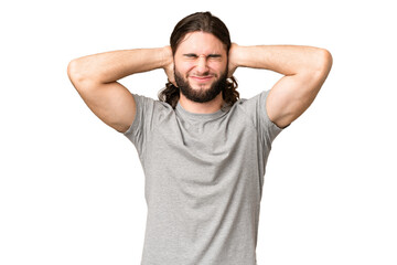 Young handsome man over isolated chroma key background frustrated and covering ears