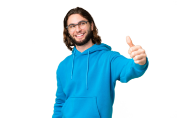 Young handsome man over isolated chroma key background giving a thumbs up gesture