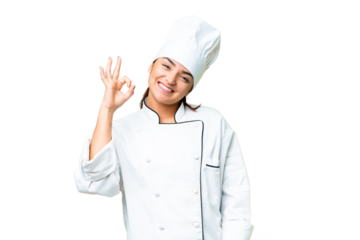 Young woman Chef over isolated chroma key background showing ok sign with fingers