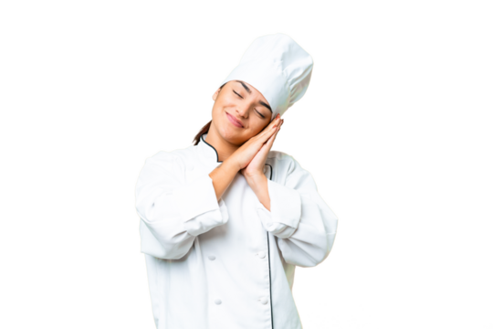 Young woman Chef over isolated chroma key background making sleep gesture in dorable expression - Powered by Adobe