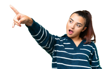 Young beauty woman over isolated chroma key background pointing away