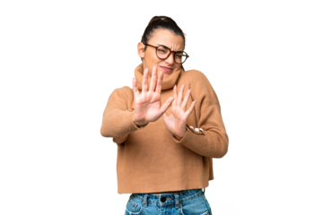 Young beauty woman over isolated chroma key background nervous stretching hands to the front