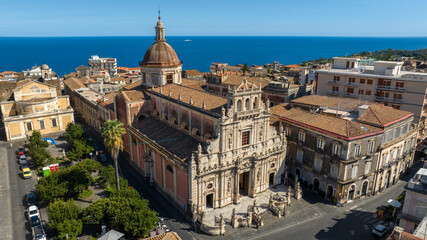 Obraz premium Aerial view of the Collegiate Basilica of San Sebastiano in Acireale. It's a Roman Catholic church in the city of Acireale in Sicily, in province of Catania, Italy. Mediterranean Sea is on the horizon