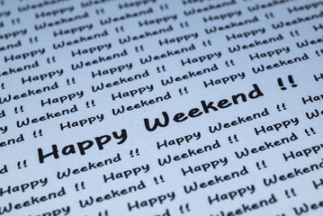 The words "Happy Weekend" are written on a piece of white paper.