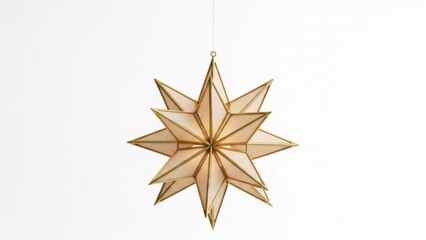 Hanging golden star decoration with delicate geometric design on white surface