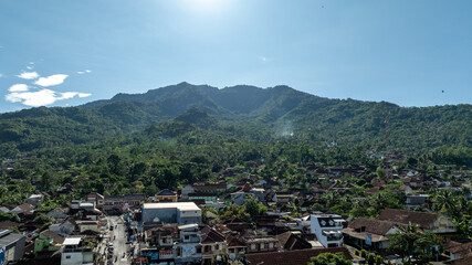Lush green mountains under clear blue sky
