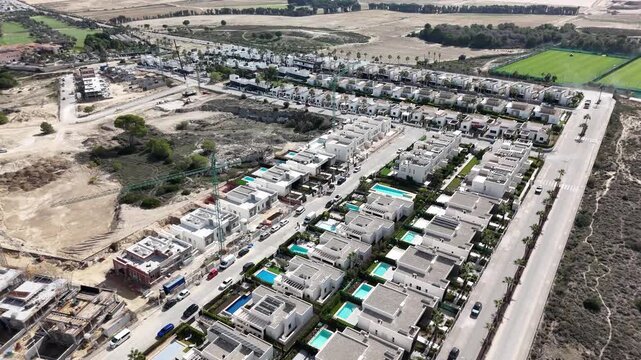 Drone circling over new housing near La Finca Golf resort in southern Spain