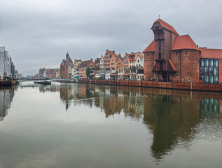Obraz premium Large panoramic view of Gdansk old city and the embankment of Weltawa river with the oldest medieval port crane