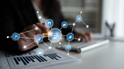 A focused business professional engages with a digital network interface, highlighting innovations in data analytics, graphs, and cloud computing technology. Tessel