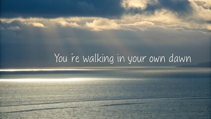 Inspiring message above calm ocean with a shimmering horizon