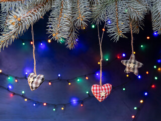 Hanging Fabric Hearts And Stars On Christmas Tree Branches With Colorful Holiday Lights