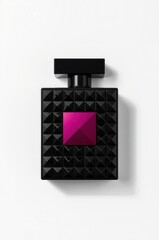 Black studded perfume bottle with pink jewel accent on white background