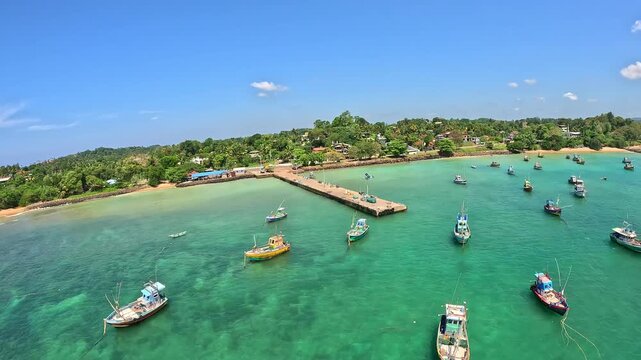 Cinematic FPV drone footage along the coastline of Sri Lanka, featuring tropical beaches, ocean waves and boats captured in dynamic aerial flight from above.