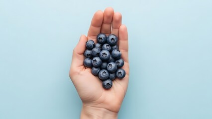 hand cupping fresh blueberries