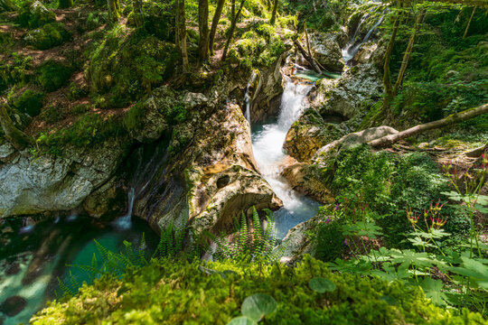 Majestic Sunik Waterfalls cascading through lush Soca Valley Triglav National Park Slovenia