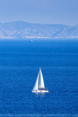 Sailboat sailing boat on the Aegean Mediterranean Sea vacation near Rhodes island, Greece