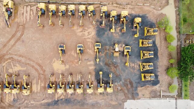 Excavator sales place or heavy equipment showroom, many excavators parked